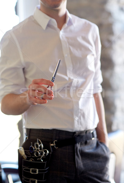close up of male stylist with scissors at salon Stock photo © dolgachov