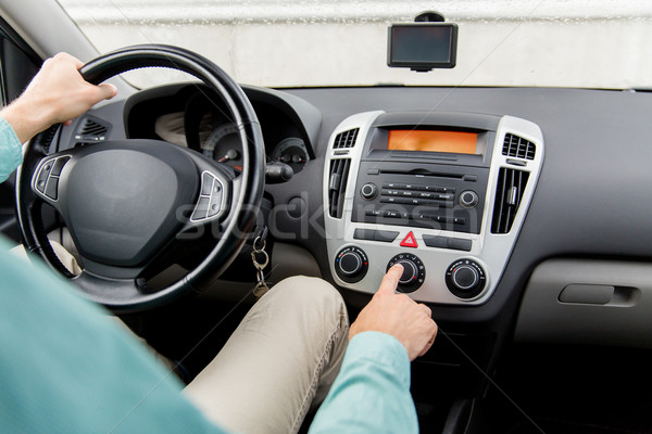 close up of male hand using climate control in car Stock photo © dolgachov