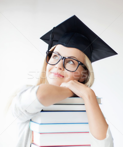 student in graduation cap Stock photo © dolgachov