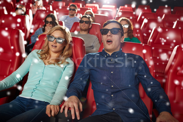 scared friends watching horror movie in 3d theater Stock photo © dolgachov