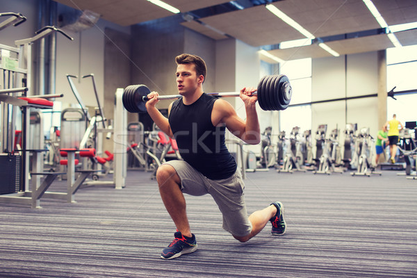 Jonge man spieren barbell gymnasium sport bodybuilding Stockfoto © dolgachov