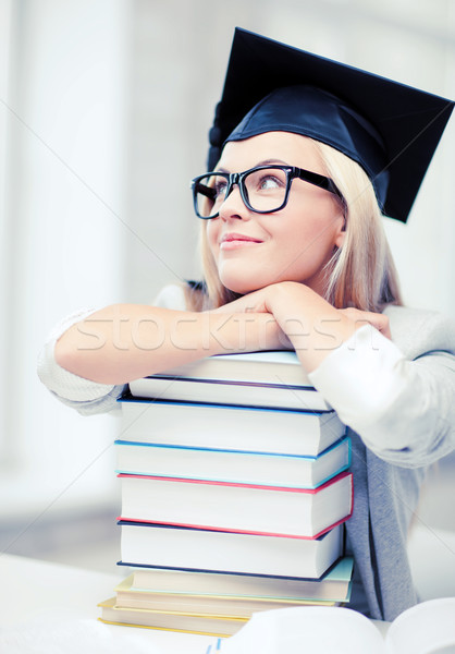 student in graduation cap Stock photo © dolgachov