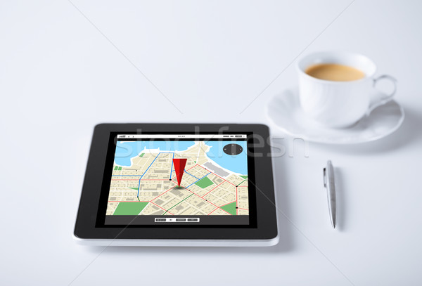 tablet pc with gps navigator map and cup of coffee Stock photo © dolgachov