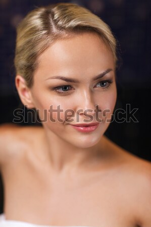 close up of young woman sitting in bath towel Stock photo © dolgachov