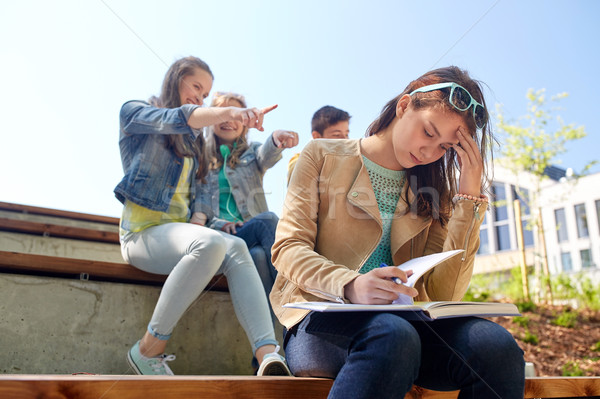 student girl suffering of classmates mockery Stock photo © dolgachov