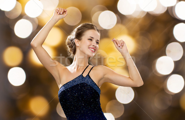 Feliz mulher dança as mãos levantadas luzes pessoas Foto stock © dolgachov