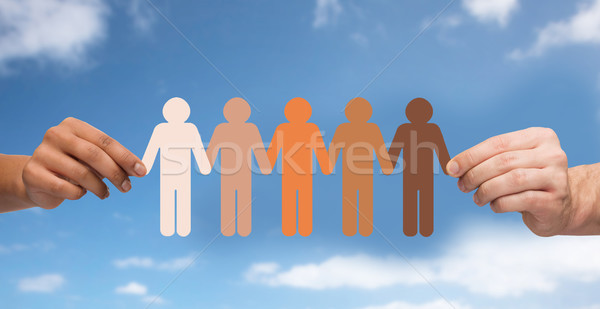 hands holding chain of people pictogram over sky Stock photo © dolgachov