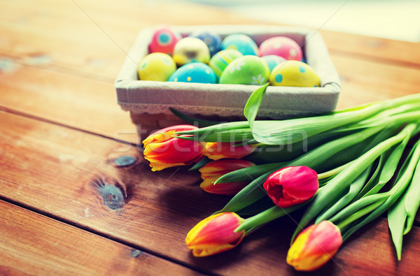 Közelkép színes húsvéti tojások virágok húsvét ünnepek Stock fotó © dolgachov