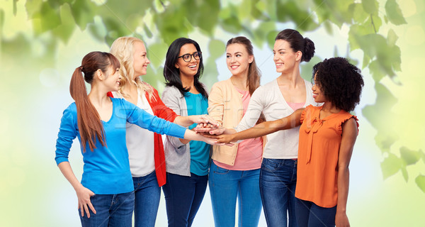 international group of women with hands together Stock photo © dolgachov