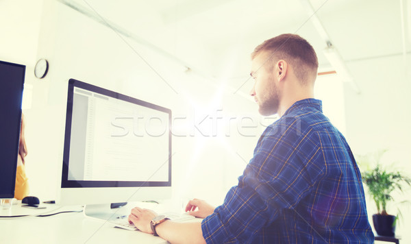 creative man or programmer with computer at office Stock photo © dolgachov