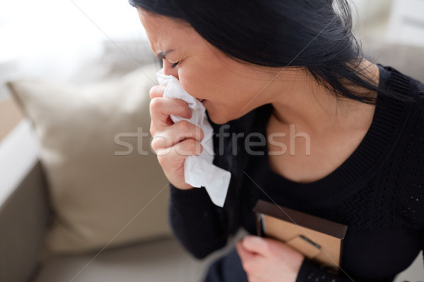 crying woman with photo frame at funeral day Stock photo © dolgachov