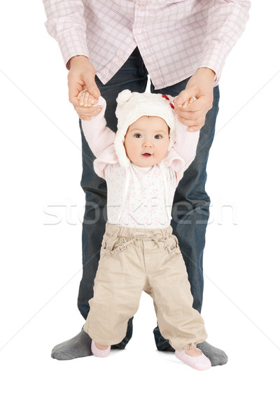 baby making first steps with father help Stock photo © dolgachov