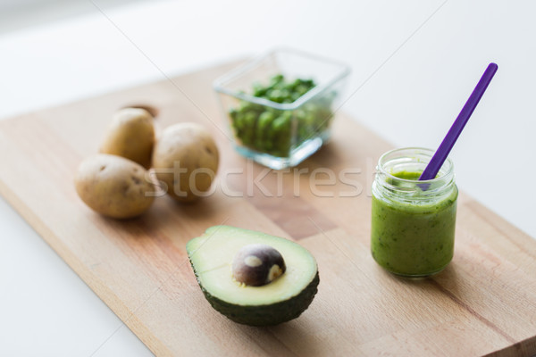 jar with puree or baby food on wooden board Stock photo © dolgachov