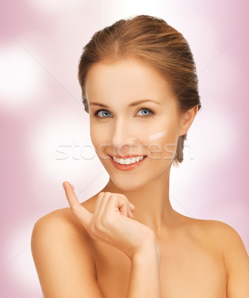 beautiful woman with moisturizing creme drop Stock photo © dolgachov