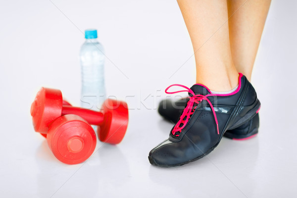 sporty woman legs with light red dumbbells Stock photo © dolgachov