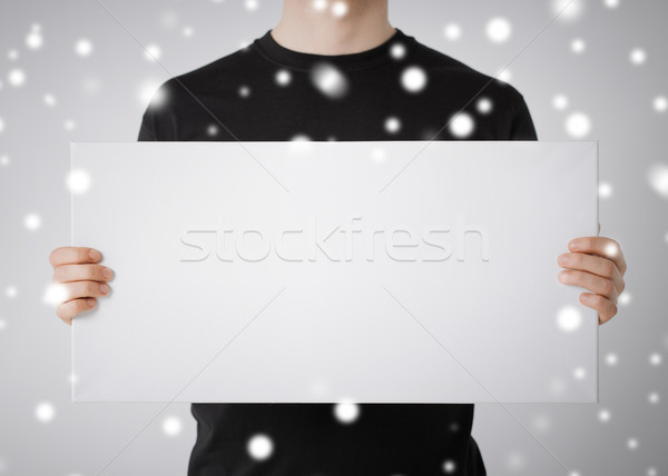 man with blank white board Stock photo © dolgachov