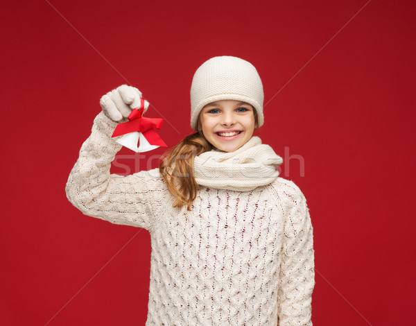 girl in hat, muffler and gloves with jingle bells Stock photo © dolgachov