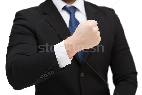 businessman showing something at his hand Stock photo © dolgachov