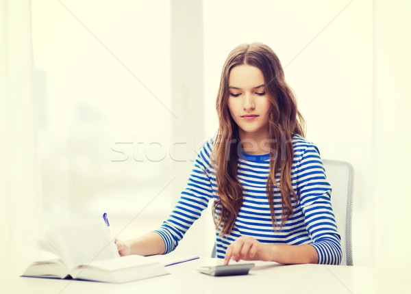 Foto stock: Estudante · menina · livro · calculadora · caderno · educação