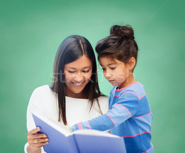 Stockfoto: Gelukkig · leraar · weinig · schoolmeisje · lezing · boek