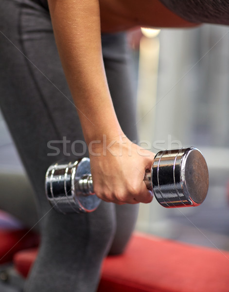 close up of couple with dumbbell exercising in gym Stock photo © dolgachov