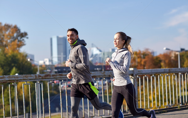 Boldog pár fut kint fitnessz sport Stock fotó © dolgachov
