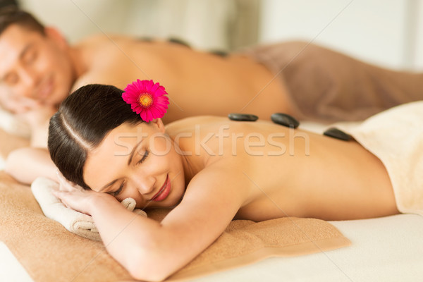 couple in spa with hot stones Stock photo © dolgachov