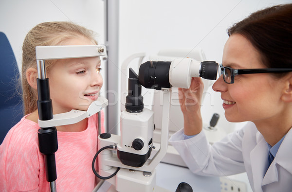 optician with tonometer and patient at eye clinic Stock photo © dolgachov