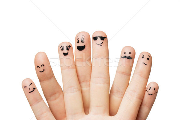 close up of hands and fingers with smiley faces Stock photo © dolgachov