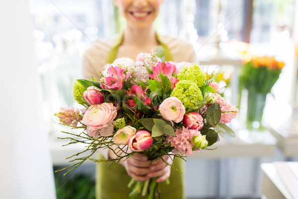 close up of woman holding bunch at flower shop Stock photo © dolgachov