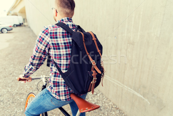 Homme fixé engins vélo sac à dos [[stock_photo]] © dolgachov