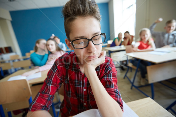 students gossiping behind classmate back at school Stock photo © dolgachov