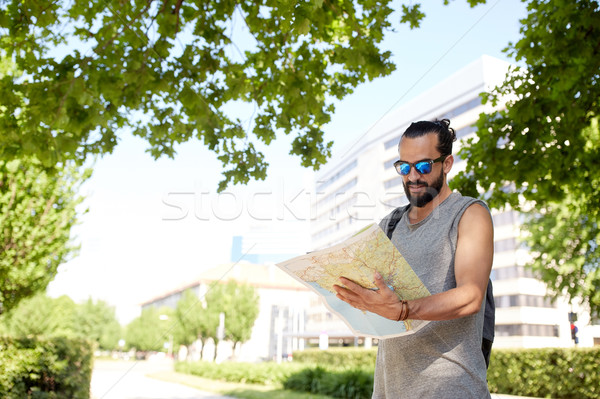 man traveling with backpack and map in city Stock photo © dolgachov