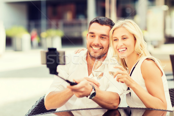 happy couple taking selfie with smartphone at cafe Stock photo © dolgachov