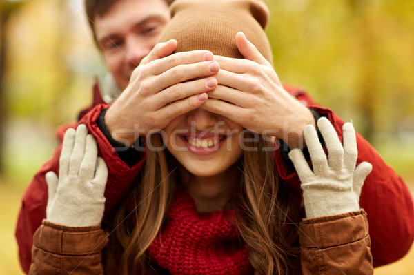 happy young couple having fun in autumn park Stock photo © dolgachov