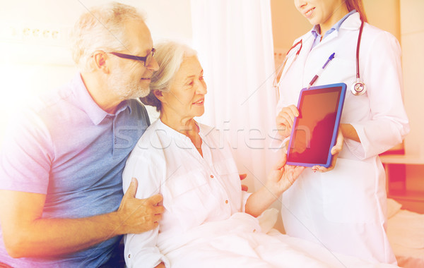 Stock photo: senior woman and doctor with tablet pc at hospital