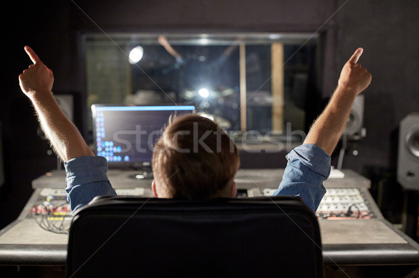 man at mixing console in music recording studio Stock photo © dolgachov