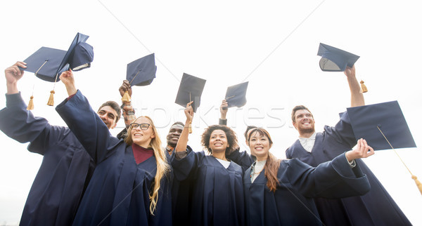 Foto stock: Feliz · estudantes · solteiros · educação · graduação