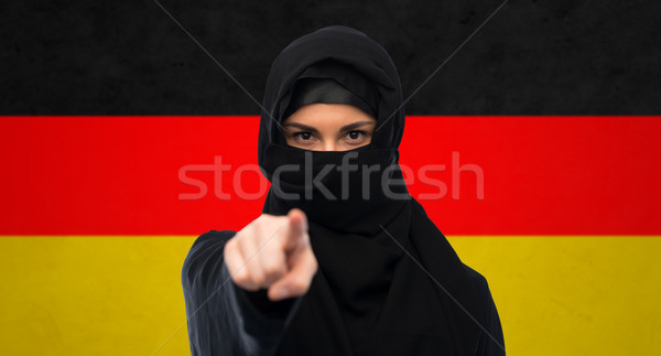 muslim woman in hijab pointing finger to you Stock photo © dolgachov