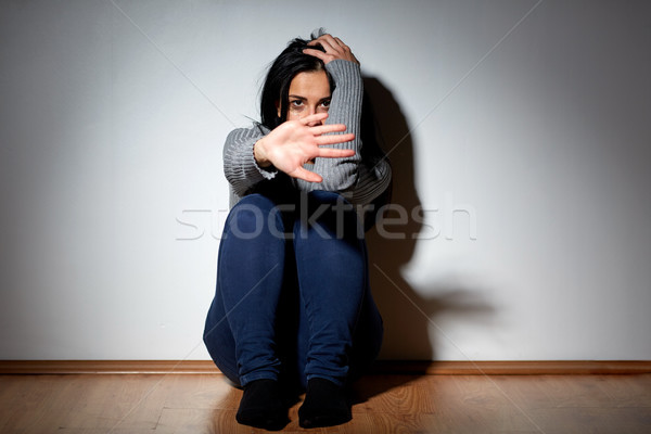 unhappy woman crying on floor at home Stock photo © dolgachov