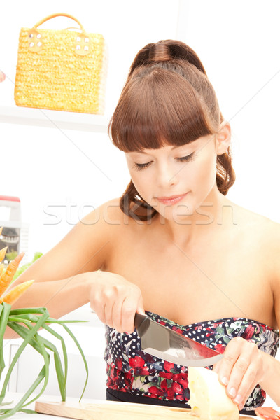 beautiful woman in the kitchen Stock photo © dolgachov