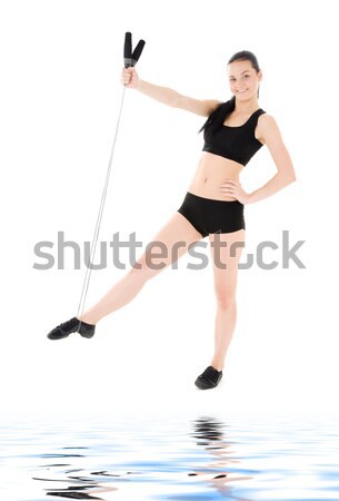 woman practicing four-limbed staff pose Stock photo © dolgachov