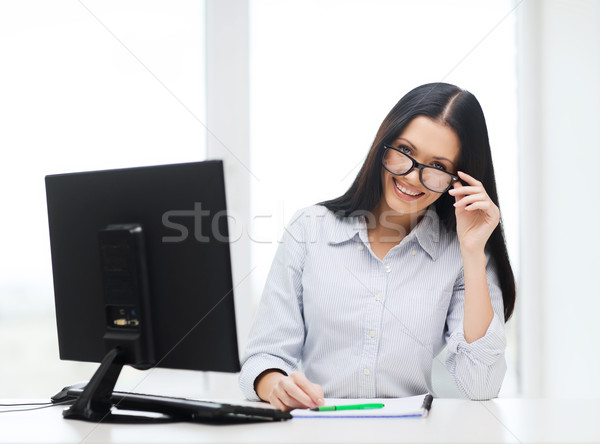 Stock photo: smiling businesswoman or student with eyeglasses