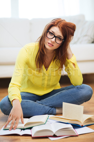 smiling student girl reading books at home Stock photo © dolgachov