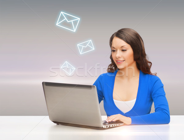 Glimlachende vrouw Blauw kleding laptop computer elektronica gadget Stockfoto © dolgachov