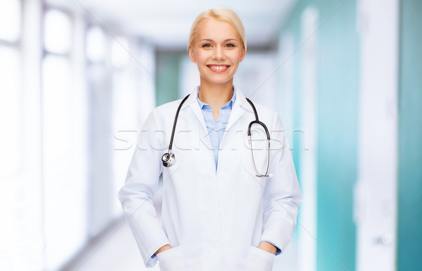 Uśmiechnięty kobiet lekarza stetoskop opieki zdrowotnej muzyka Zdjęcia stock © dolgachov