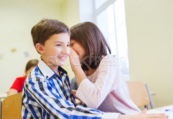 Lächelnd Schülerin flüstern Mitschüler Ohr Bildung Stock foto © dolgachov