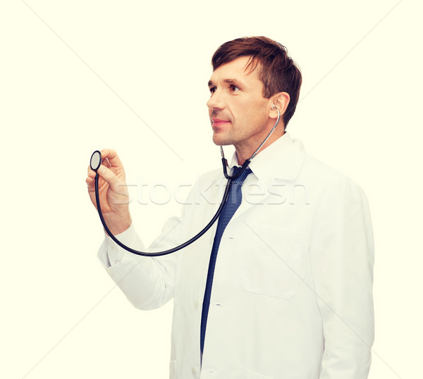 young male doctor with stethoscope Stock photo © dolgachov