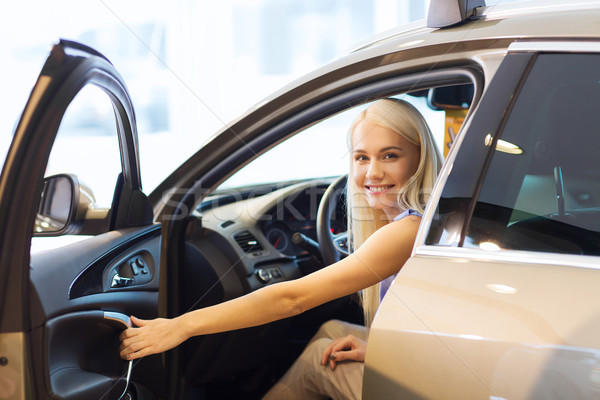 happy woman inside car in auto show or salon Stock photo © dolgachov