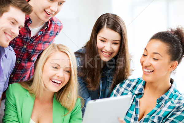 students looking at tablet pc in lecture at school Stock photo © dolgachov